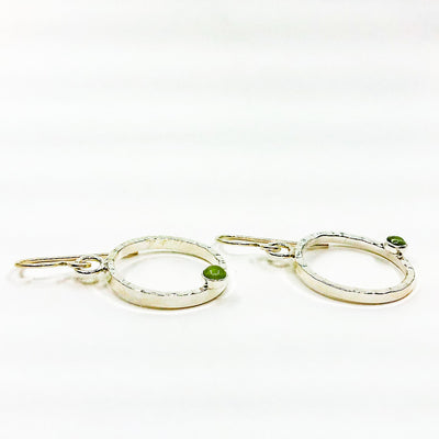 side angle view of Sterling Pluto Earrings with Peridot by Judie Raiford