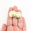 14k Gold Filled Domed Ball Pein Earrings by Judie Raiford held in hand