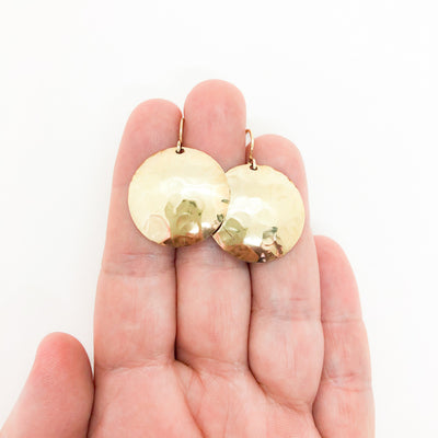 14k Gold Filled Domed Ball Pein Earrings by Judie Raiford held in hand