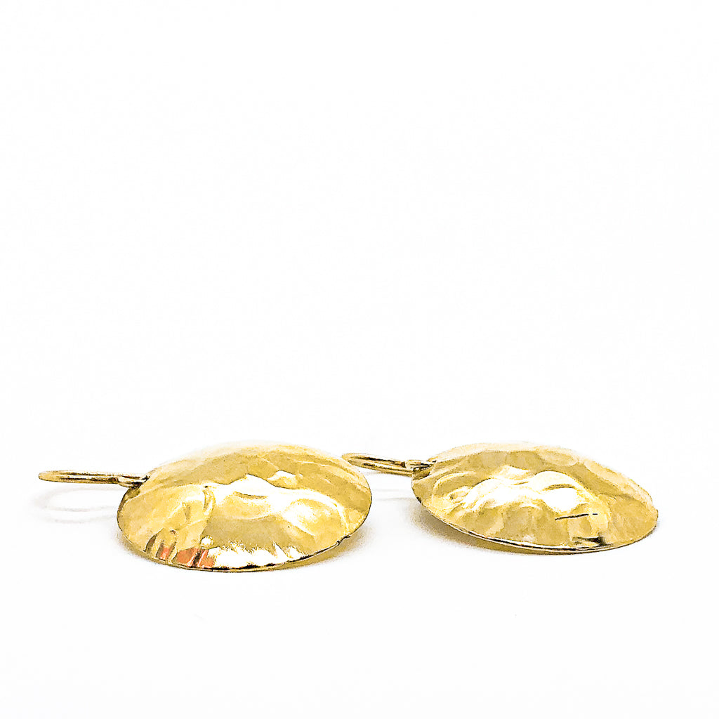 side angle flat lay of 14k Gold Filled Domed Ball Pein Earrings by Judie Raiford