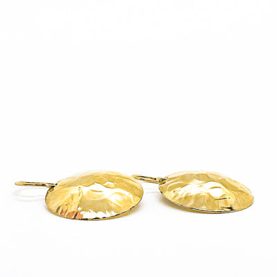 side angle flat lay of 14k Gold Filled Domed Ball Pein Earrings by Judie Raiford