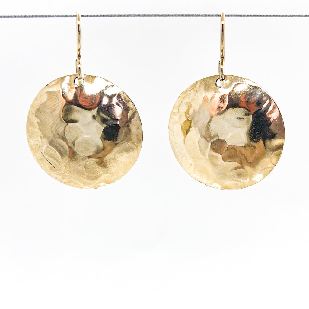14k Gold Filled Domed Ball Pein Earrings by Judie Raiford hanging on a wire