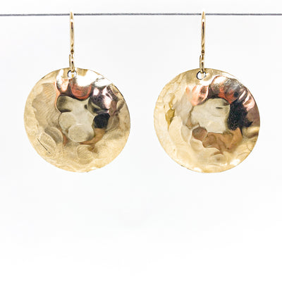 14k Gold Filled Domed Ball Pein Earrings by Judie Raiford hanging on a wire