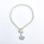 White Pearl Double Swirl Necklace by Judie Raiford