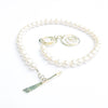 side angle view of White Pearl Double Swirl Necklace by Judie Raiford