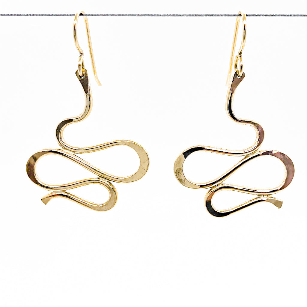 14k Gold Filled Touch of Romance Earrings by Judie Raiford hanging on a wire