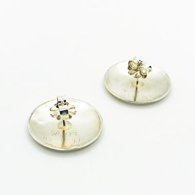 side angle bottom view of Sterling and 24k Textured Dome Earrings by Judie Raiford