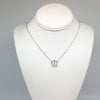 sterling silver Tiny Peace Sign Necklace by Judie Raiford on mannequin
