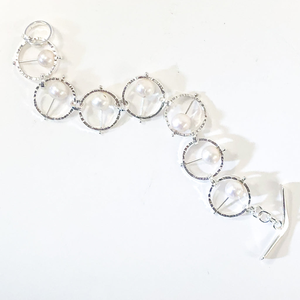Flat Lay view of Not Naught Round Sterling Bracelet with Pearls by Judie Raiford 