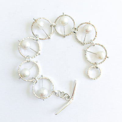 Flat Lay view of Not Naught Round Sterling Bracelet with White Pearls by Judie Raiford