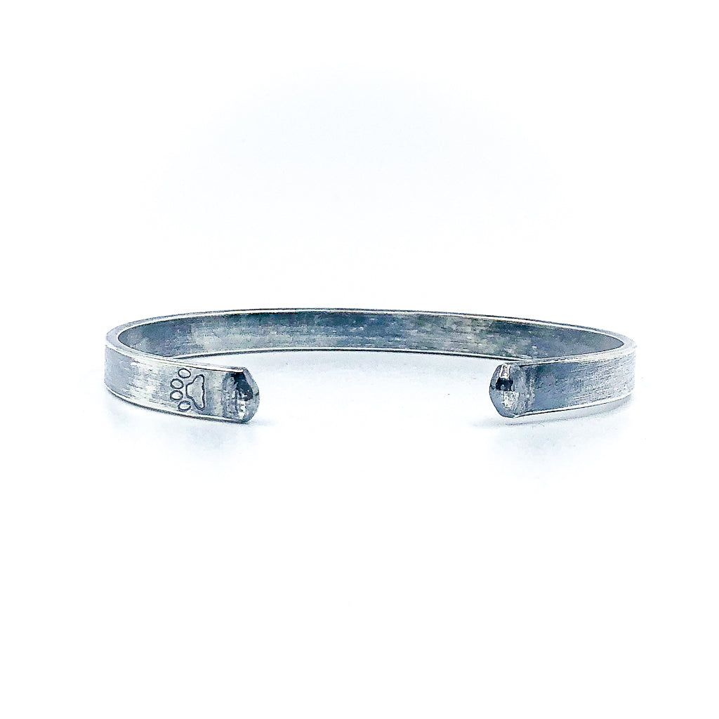 back view of Oxidized Sterling Flat Band Cuff with Paw Print by Judie Raiford