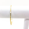 14k Gold Filled Bubble Texture Bangle by Judie Raiford hanging on white bracelet display stand