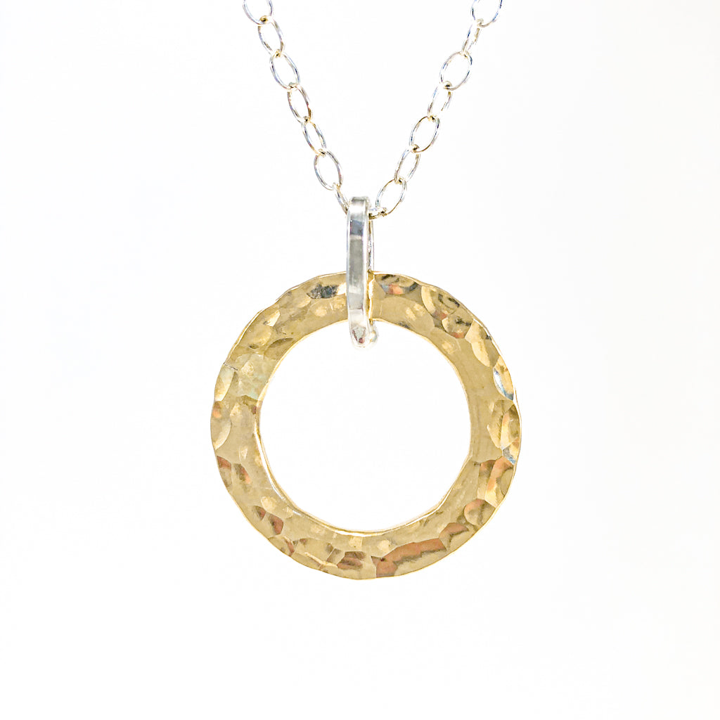 detail of pendant view of Sterling and 14k Gold Filled Ball Pein Hammered Circle Pendant Necklace by Judie Raiford