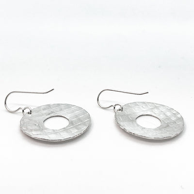 back angle view of sterling silver Square Hammered Olive Earrings by Judie Raiford