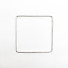 over top view of Sterling Hammered Square Bangle by Judie Raiford