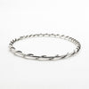side angle view of Single Wrapped Sterling Bangle by Judie Raiford