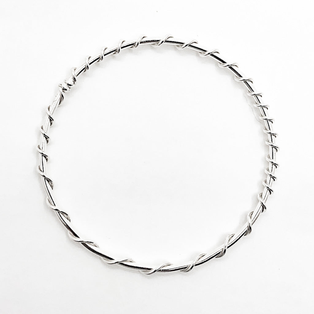 over top view of Single Wrapped Sterling Bangle by Judie Raiford