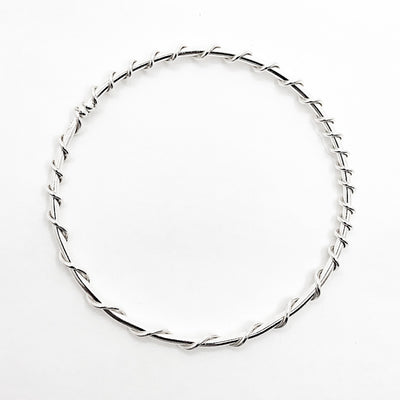 over top view of Single Wrapped Sterling Bangle by Judie Raiford