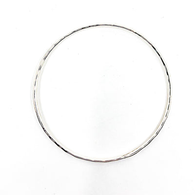 over top view of Sterling Ball Pein Bangle by Judie Raiford