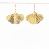 14k Gold Filled Mini Ginkgo Earrings by Judie Raiford hanging on a wire