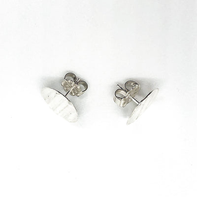 overhead view of sterling silver Corrugated Post Earrings by Judie Raiford