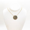 14k Gold Filled Ball Pein Flat Disc Lynne Necklace by Judie Raiford displayed on white mannequin bust