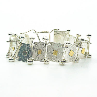 front side view of Sterling and 22k Singer Bracelet by Judie Raiford