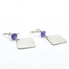 side angle view of Sterling Goat Earrings with Upside Down Amethyst by Judie Raiford