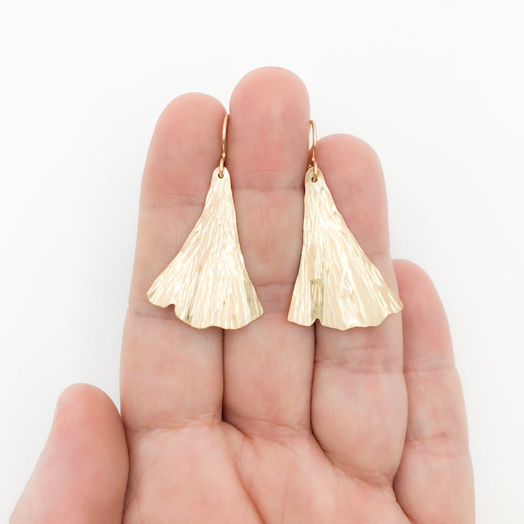 14k Gold Filled Ginkgo Ra Ra Earrings by Judie Raiford held in hand