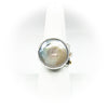 size 7.5 Sterling, 14k, 22k Deckled Edge Coin Pearl Ring by Judie Raiford on white ring display stand