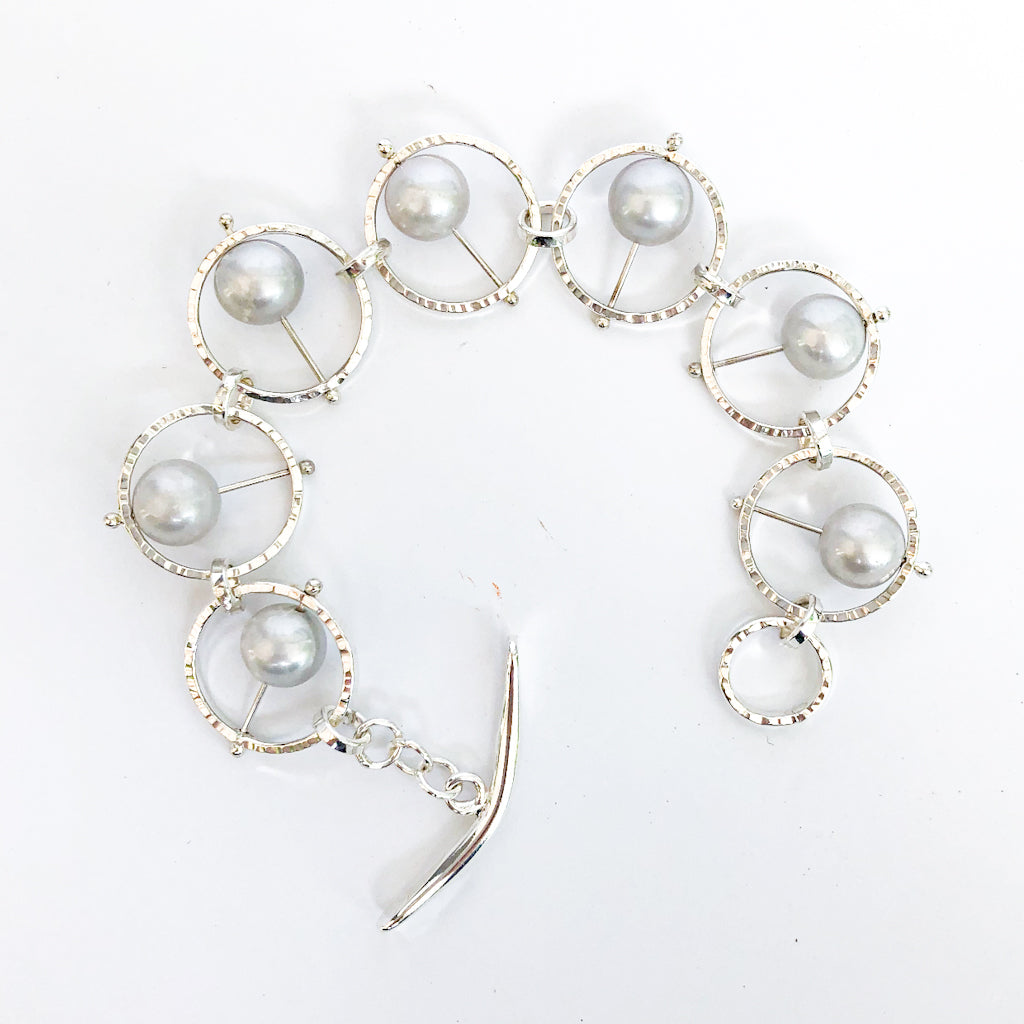 Flat Lay view of Not Naught Round Sterling Bracelet with Gray Pearls by Judie Raiford