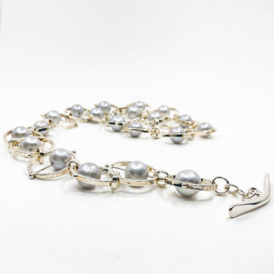 side angle view of Sterling Not Naught Round Necklace with Gray Pearls by Judie Raiford