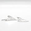 side angle view of Sterling Silver Textured Heart Earrings by Judie Raiford