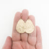 14k Gold Filled Mom's Hammer Flat Pear Earrings by Judie Raiford held in hand