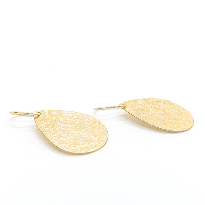 side angle view of 14k Gold Filled Mom's Hammer Flat Pear Earrings by Judie Raiford