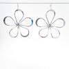 Sterling Flower Power Earrings by Judie Raiford hanging on wire