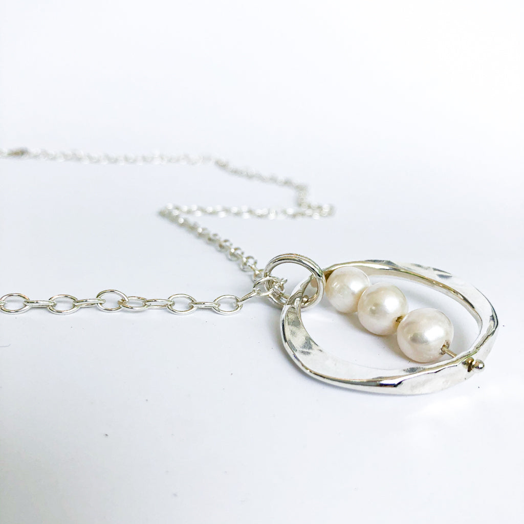 angle view of Large Naught Necklace with 3 White Pearls by Judie Raiford