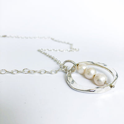 angle view of Large Naught Necklace with 3 White Pearls by Judie Raiford