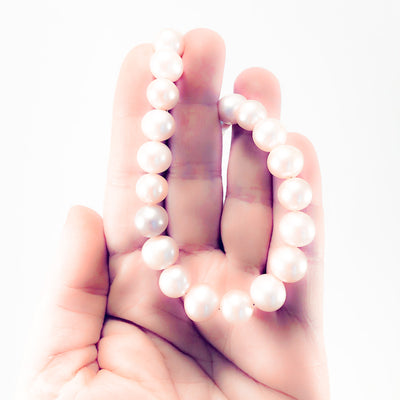 Blush Pearl Necklace by Judie Raiford held in hand