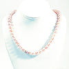 Blush Pearl Necklace by Judie Raiford on white jewelry display bust