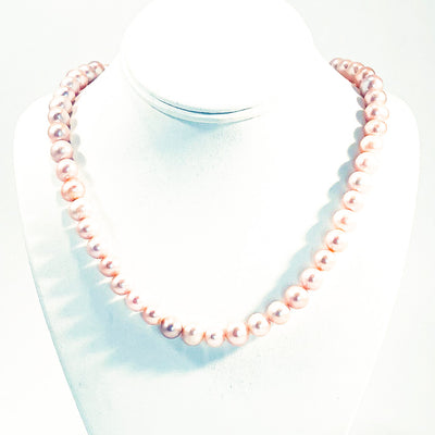 Blush Pearl Necklace by Judie Raiford on white jewelry display bust