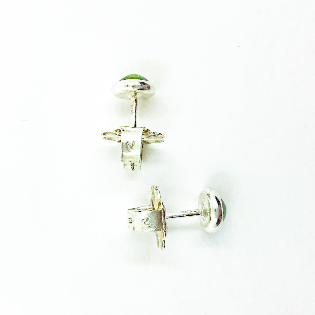 over head view of 6mm Peridot Cabochon Stud Earrings by Judie Raiford