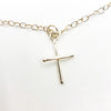 detail view of Sterling Tiny Cross Necklace by Judie Raiford