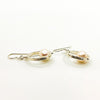 side angle view of Sterling Not Naught Round Pearl Earrings with White Pearls by Judie Raiford