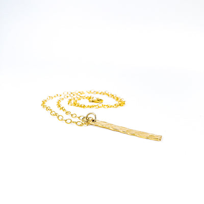 side angle view of 14k Gold Filled Hammered Bar Necklace by Judie Raiford