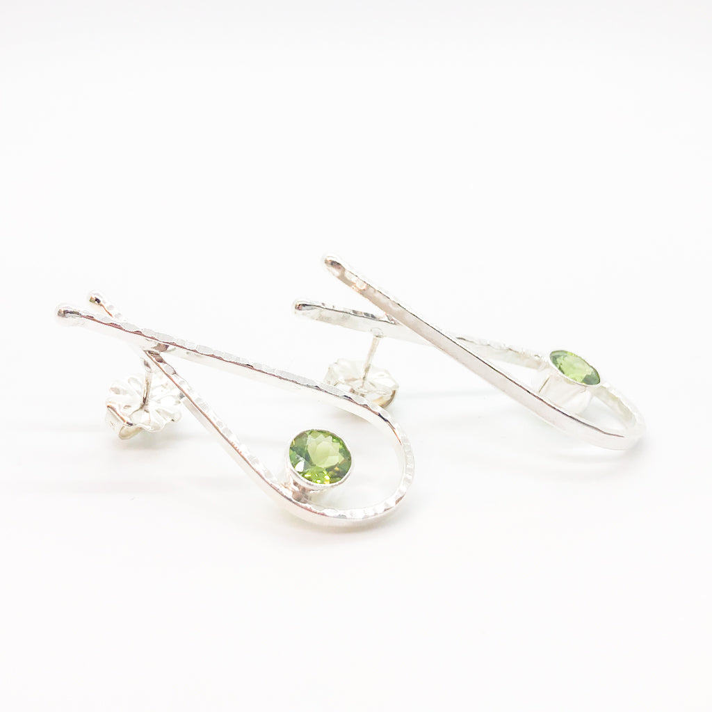 side angle view Sterling Jody Looped Earrings with Peridot by Judie Raiford