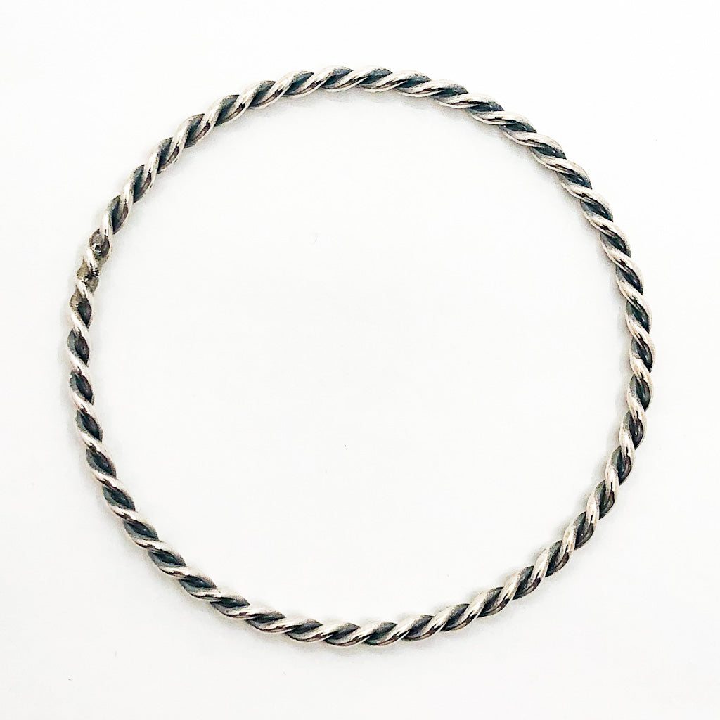 over top view Double Twist Oxidized Sterling Bangle by Judie Raiford