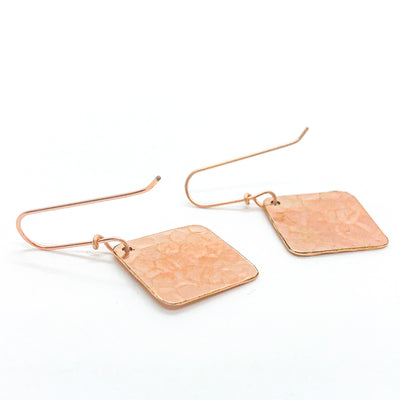back side view of 14k Rose Gold Ball Pein Square Earrings by Judie Raiford
