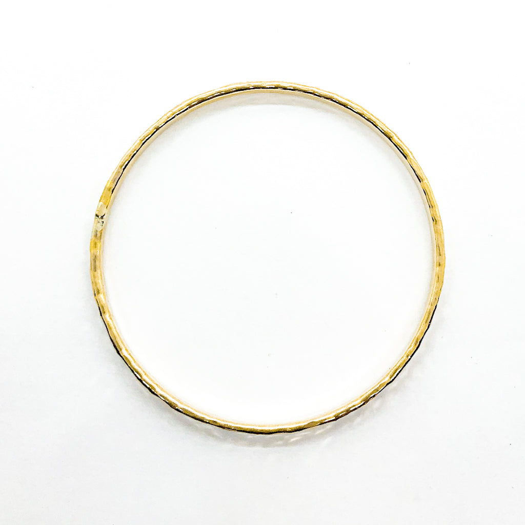 over top view of 14k Gold Filled Ball Pein Hammered Bangle by Judie Raiford