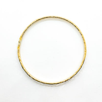 over top view of 14k Gold Filled Ball Pein Hammered Bangle by Judie Raiford